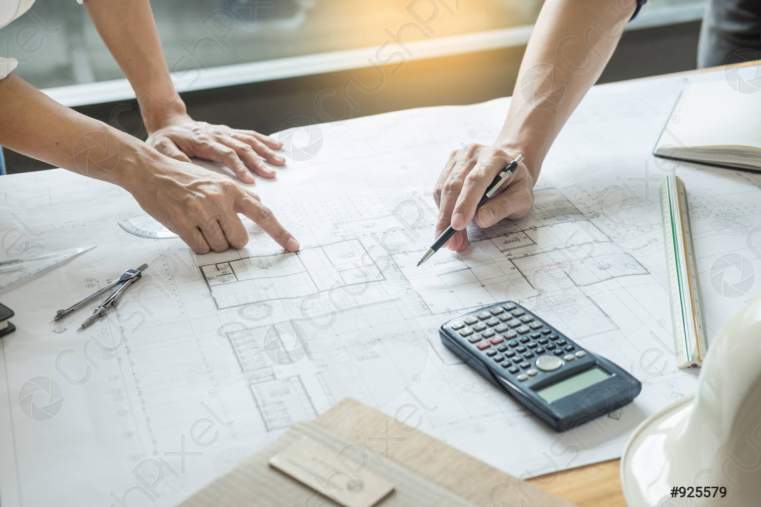 professional-architects-working-on-blueprint-925579